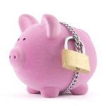 11190673 - piggy bank secured with padlock. clipping path included.
