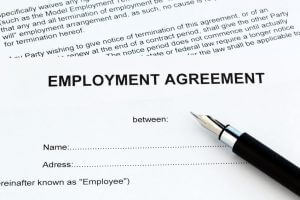 A piece of paper that is titled "EMPLOYMENT AGREEMENT"