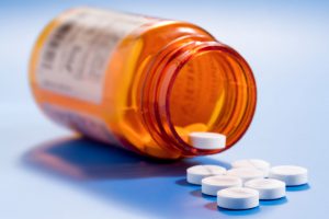 A photo of a bottle of pills.