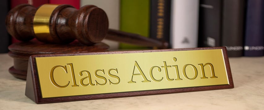 class action sign with a gavel and books